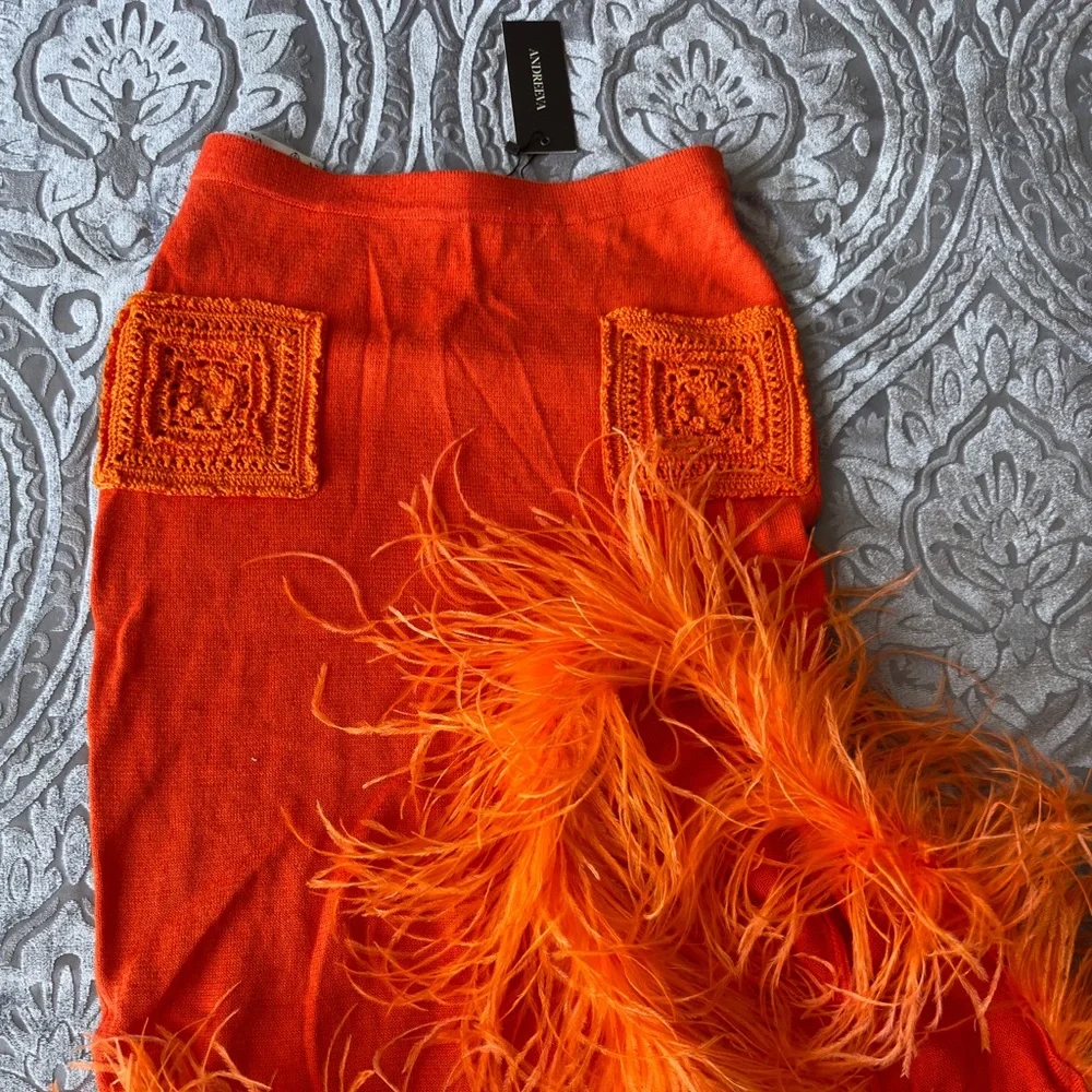 ANDREEVA ORANGE KNIT SKIRT-DRESS WITH FEATHER - Picture 2 of 3